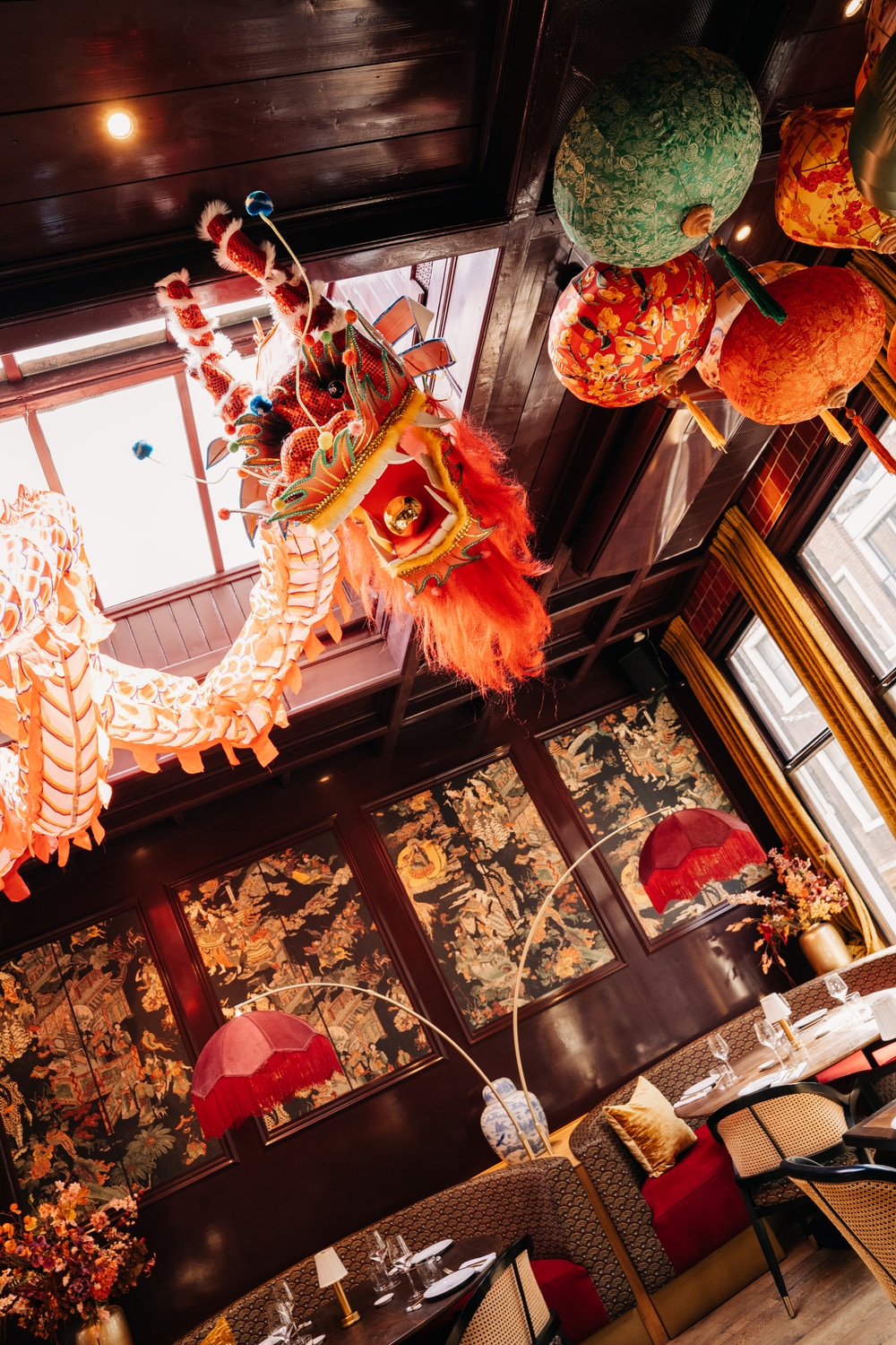The restaurant seen from above, with the dragon and lanterns over the tables